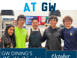 We Eat At GW: GW Dining's Monthly Newsletter for October, 4 students standing and smiling with Celebrity Chef Thai Deng at Teaching Kitchen event