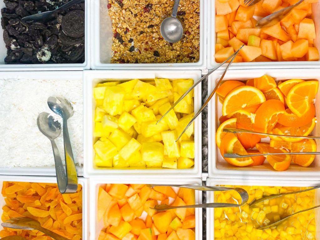 View of a granola bar from above with fruit and nut toppings