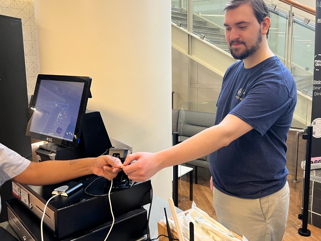 OZZI Step 1: Give your OZZI token to the cashier working at the entrance of the dining hall.